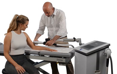 Female patient receiving high energy inductive therapy (HEIT) with the emFieldPro system during arm treatment.