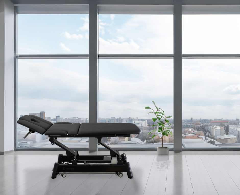 Z Ultimate treatment table in clinical setting highlighting stable base and adjustable height system