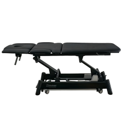 Z Ultimate treatment table with arm supports stowed for streamlined patient access